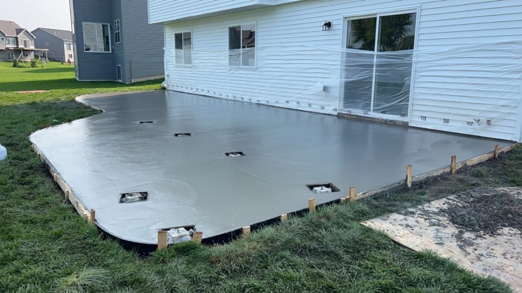 Elegant concrete patio installation by Legacy Concrete
